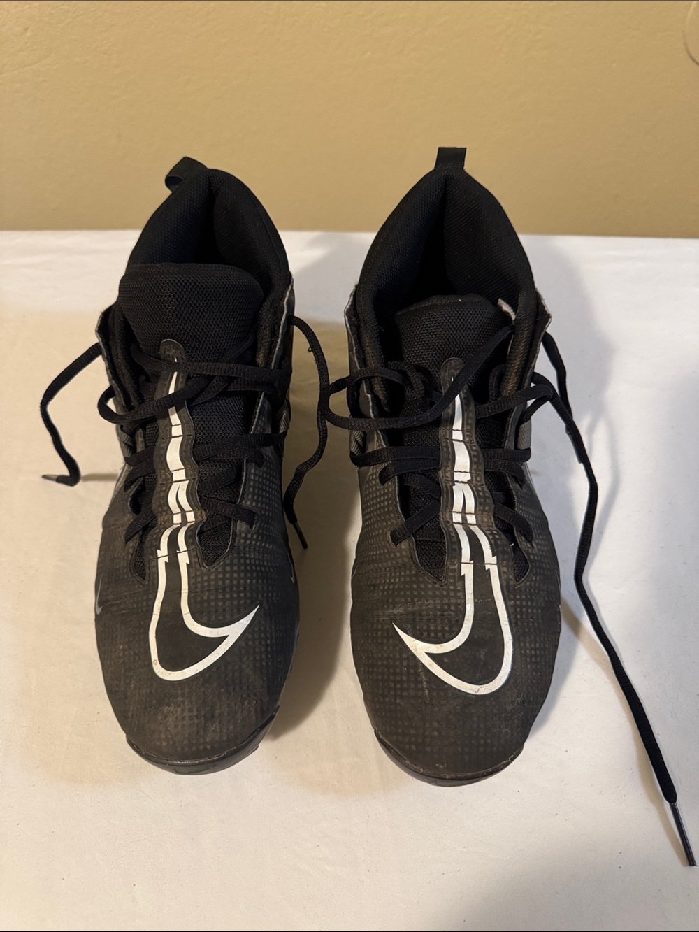 Nike Men’s Black Athletic Cleats with White Swoosh Accents
